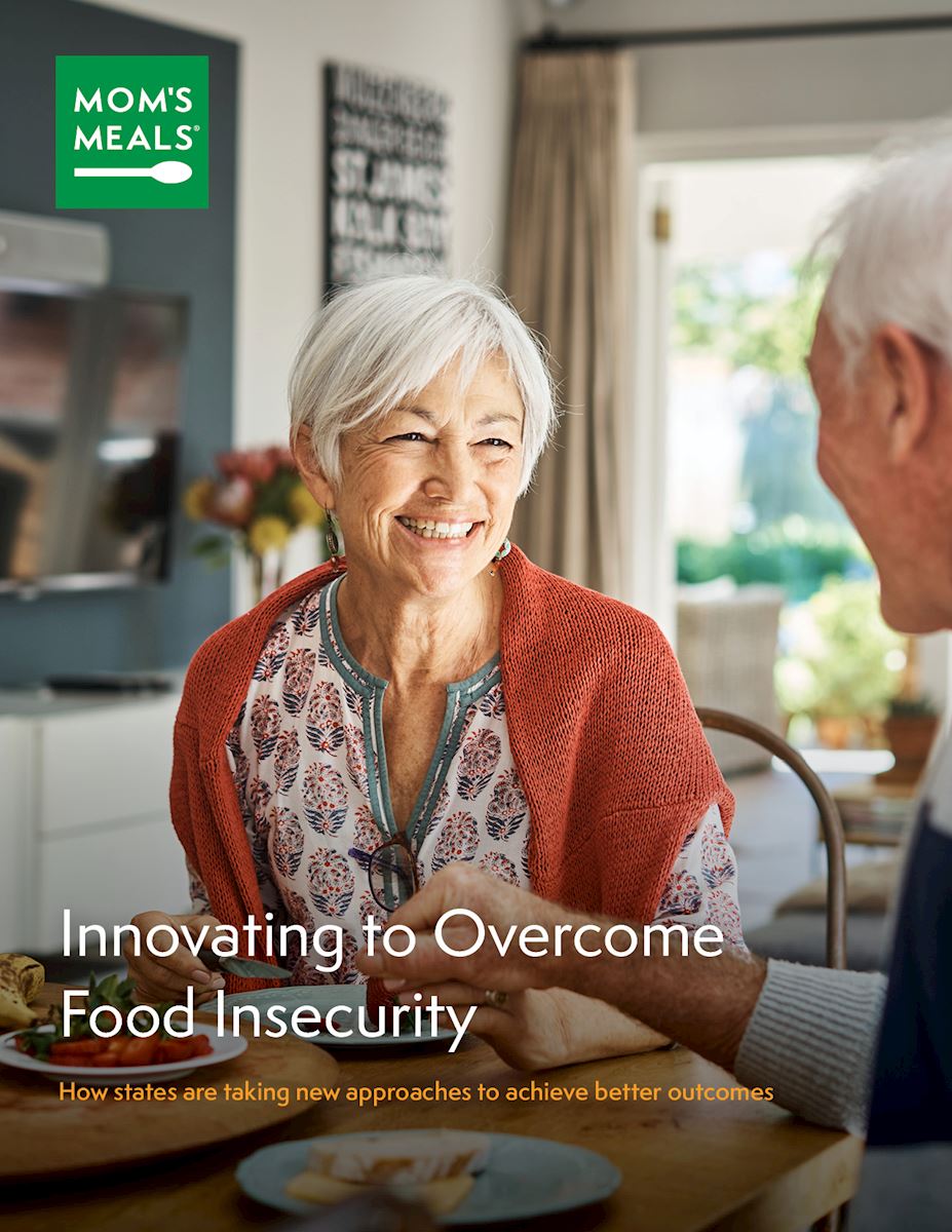 Food insecurity white paper cover with man and woman at a table holding hands