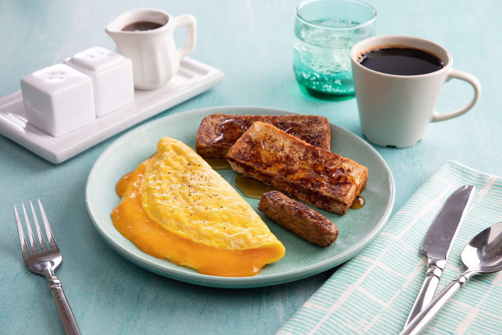 lower-sodium cheesy egg omlette with sausage and french toast sticks
